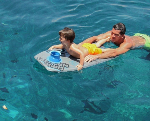 Father and Son Enjoying The Fair Wind AM Snorkel Cruise