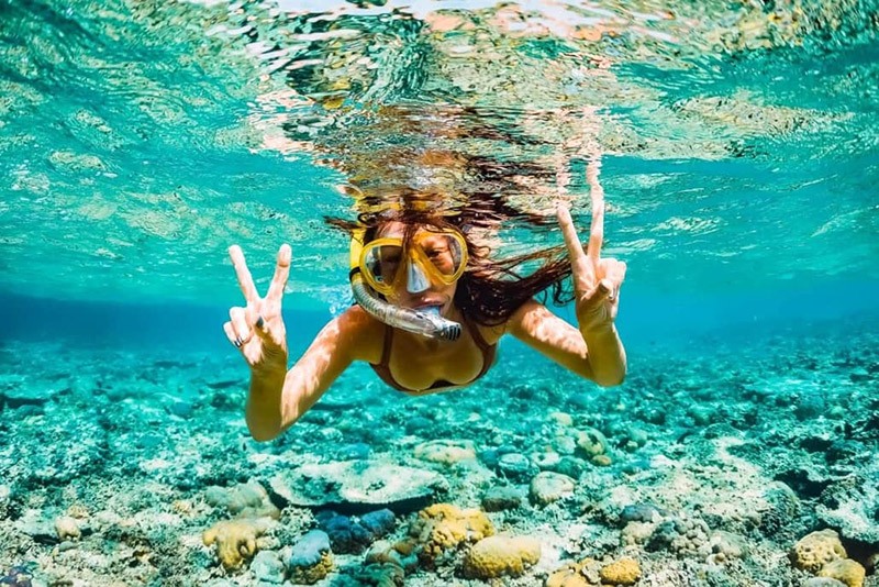 Snorkeler-Under-Water-Ocean-Reef-Girl-Hawaii